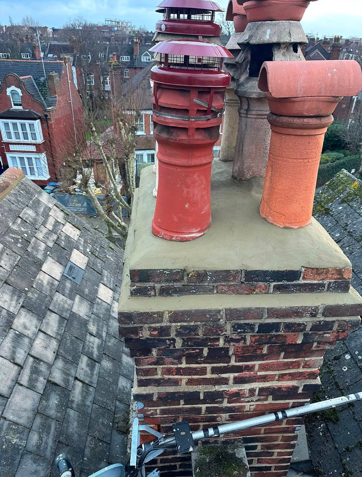 Chimney repair work being completed by MO Roofing