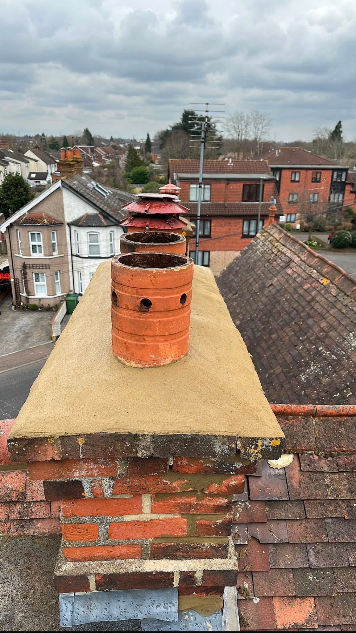 Detailed chimney repair and tile work by MO Roofing
